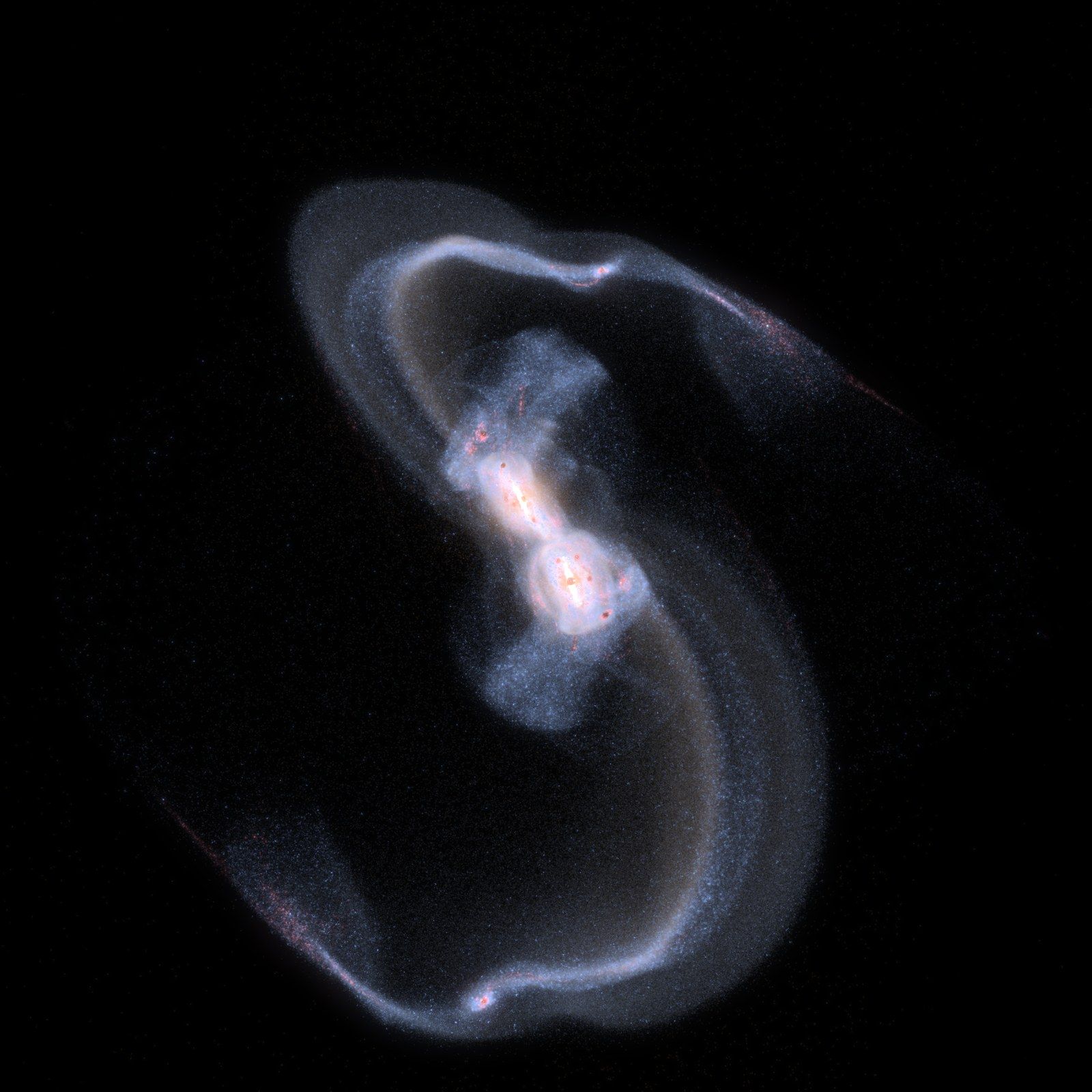 Two spiral galaxies colliding, with long tidal tails of stars